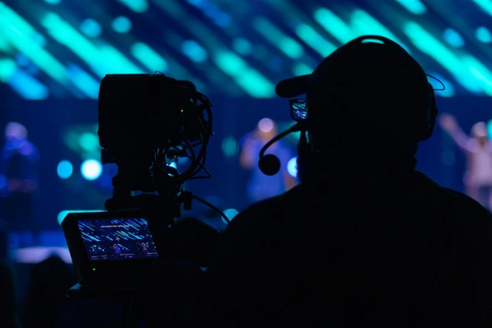 a couple of people wearing vr headsets and looking at a computer screen